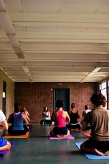 Yoga Class men and women in yoga class