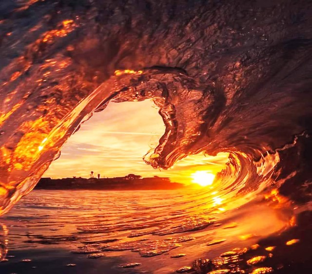 sunset through heart-shaped ice view love view of a sunset from a heart shaped ice cavern
