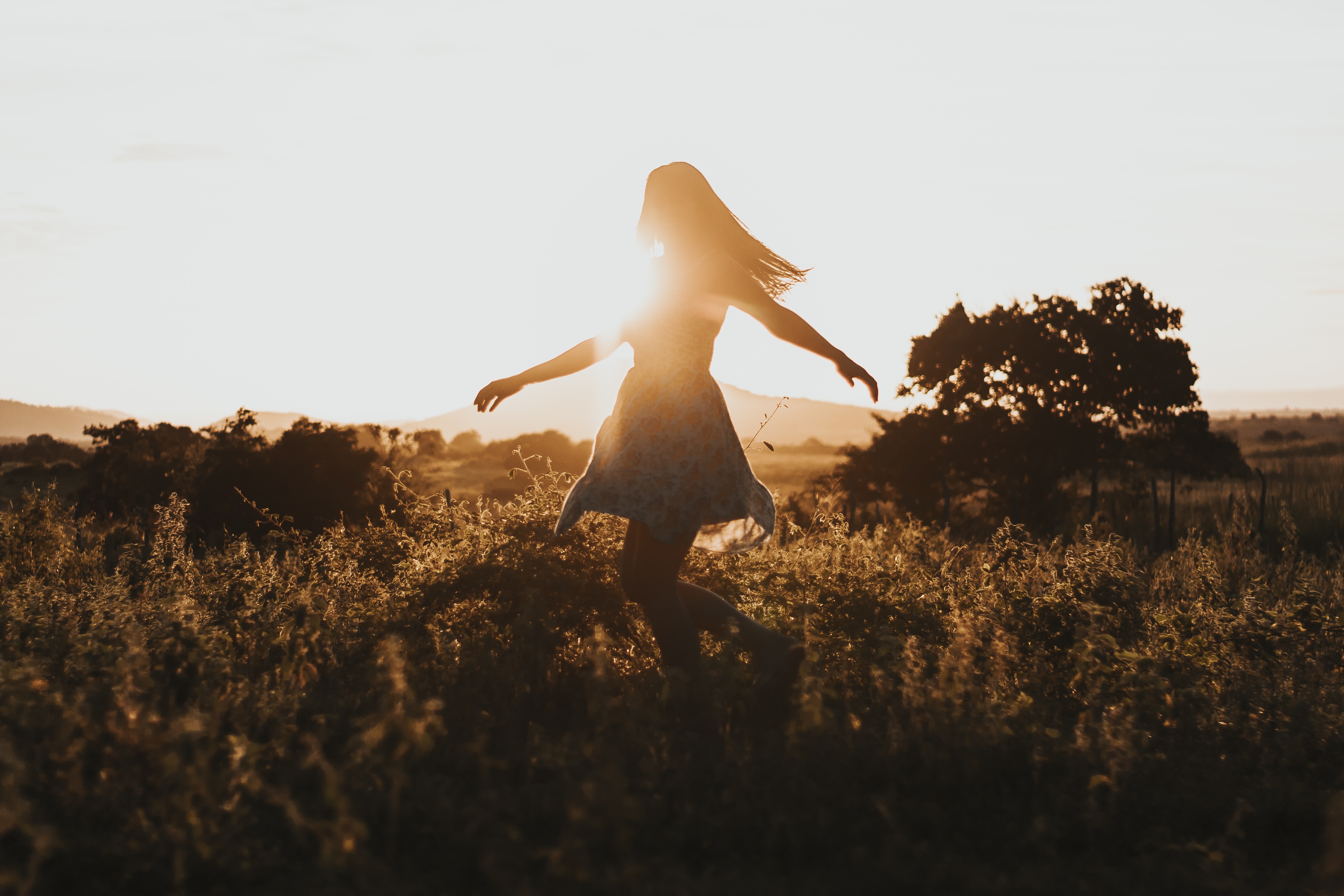 girl dancing in sunshine